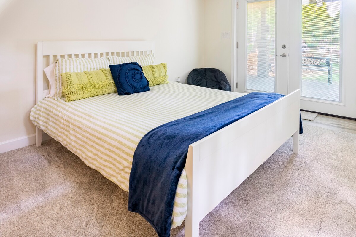Bedroom with white furniture and blue accents