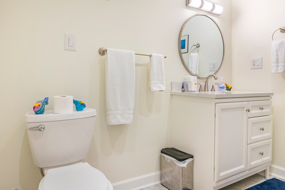 Full bathroom with modern fixtures and hexagonal tile flooring