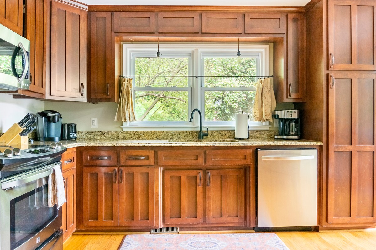 Full kitchen with cherry cabinets, granite countertops, and stainless appliances