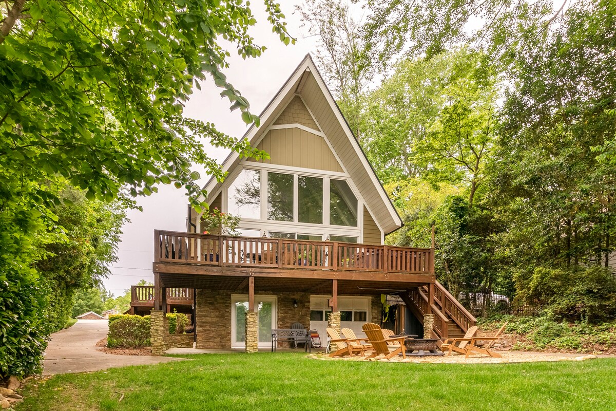 A-frame lakeside exterior with deck and natural setting