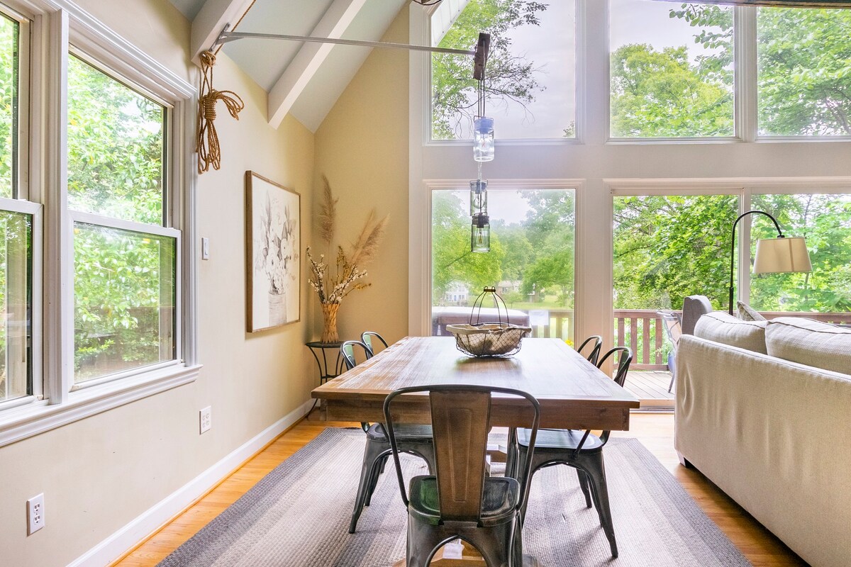 Elegant dining room with wood table and large windows